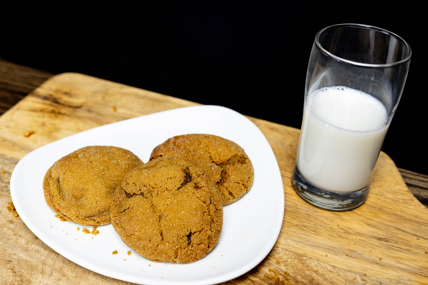 Three soft-baked cookies with a glass of milk—sweet and simple for easy meal planning treats.